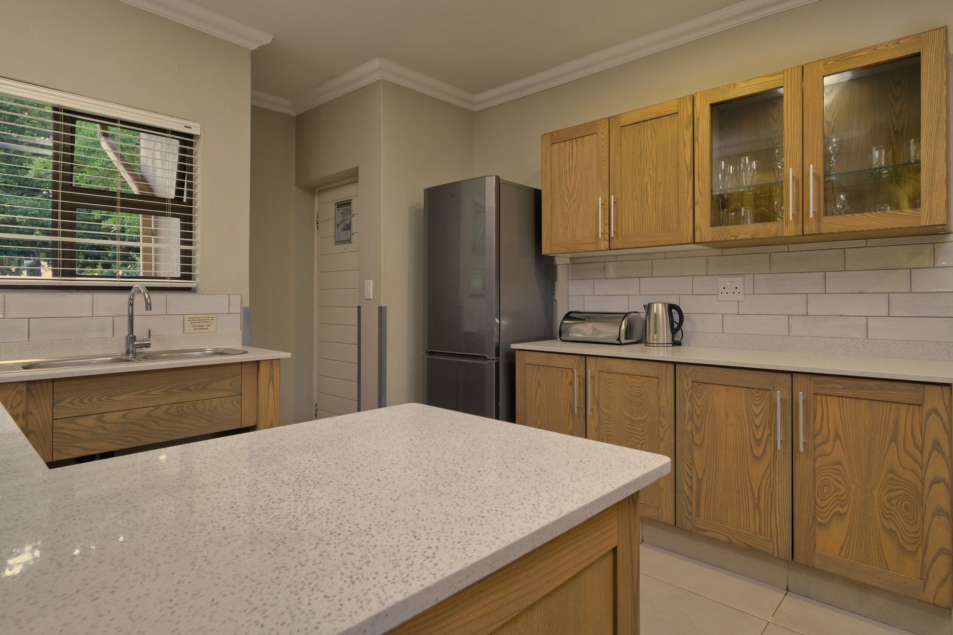 Stylish kitchen interior featuring wooden cabinetry and modern appliances in Temecula, CA
